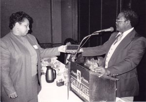 Kathleen Saadat accepts an award from the Oregon Assembly for Black Affairs, circa 1988.