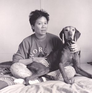 Kitty at her water tower home with her first Vizsla, Meggie Senior, San Pablo, California, 1988. Photo credit: Robert Giard. 1988. Photo courtesy of Kitty Tsui.