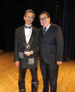 Kitty Tsui with Alice Y. Hom upon receiving the 2016 Phoenix Award for Lifetime Achievement from APIQWTC, Asian Pacific Islander Queer Women & Transgender Community, the largest organization of API queer women and transgender folk in the country.