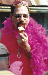 Luigi Ferrer enjoying magical faerie ice cream on a hot day on the knole, 2002, Short Mountain Sanctuary, TN.