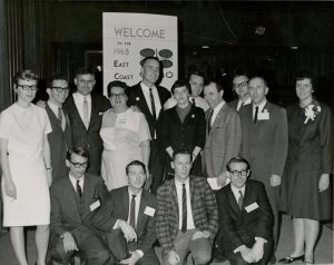 Members from the Council on Religion and the Homosexual, Daughters of Bilitis, Janus Society, Society for Individual Rights, and Tavern Guild gather at the ECHO (East Coast Homophile Organizations) conference in New York City, NY, September 25-26, 1965. L-R for those standing: Marjorie McCann (Secretary, DOB), Clark Pollack (President, Janus), Evander Smith (Tavern), Shirley Willer (President, DOB), Jack Nichols (Vice President, Mattachine DC), Carole LeHane aka Carol Randall (DOB), William Beardemphl (President, SfIR), Robert Sloane Basker (President, Mattachine Midwest), Neale Secor (Council), Frank Kameny, (President, Mattachine DC), and Joan Fleischmann aka Joan Fraser (DOB). L-R for kneeling front row: Julian Hodges (President, Mattachine NY); Dick Leitsch, (Vice President, Mattachine NY); Terry (Mattachine Midwest); John Marshall (Mattachine DC). Photo Credit: Kay Tobin Lahusen. Photo courtesy of Marge McCann.