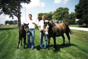 L-R: Matt Russell and husband Patrick Standley two years before buying their own farm, August 2002, Anita, IA.
