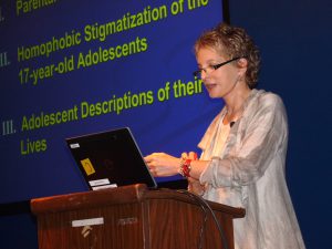 Nanette lecturing on her longitudinal lesbian family study, Burlington, Vermont, 2014. Photo courtesy of Nanette Gartrell and Dee Mosbacher.