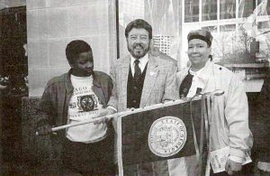 (L-R) Cherry Hussain, Ed Scruggs, and Pat Hussain at the first press conference: Olympic Experience, 1994, Underground Atlanta, GA. Courtesy of Pat Hussain.