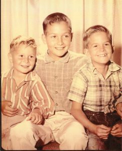 (L-R): Dale Ashburn, Ted Asburn, and Roy Ashburn as children. Roy shares, “Three brothers – Dale, Ted, and Roy. My brothers are looking away – my eyes are on you. I love the connection with people.” Photo courtesy of Roy Ashburn.