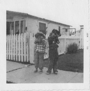 Roy on the left, pointing a gun away from the camera and dressed as a cowboy in a plaid shirt. He shares, “I was always attracted to the West and the cowboy life. Childhood heroes included Roy Rogers (King of the Cowboys) and Sky King.” Photo courtesy of Roy Ashburn.