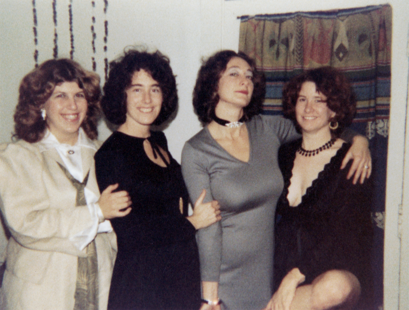 Terry as a “newly-minted lesbian” on New Year’s Eve, 1976. L-R: Carolyn Myers, her collaborator; Nancy Baum, her sister; Terry Baum; Sherry McVickar, her first woman lover. Photo courtesy of Terry Baum.
