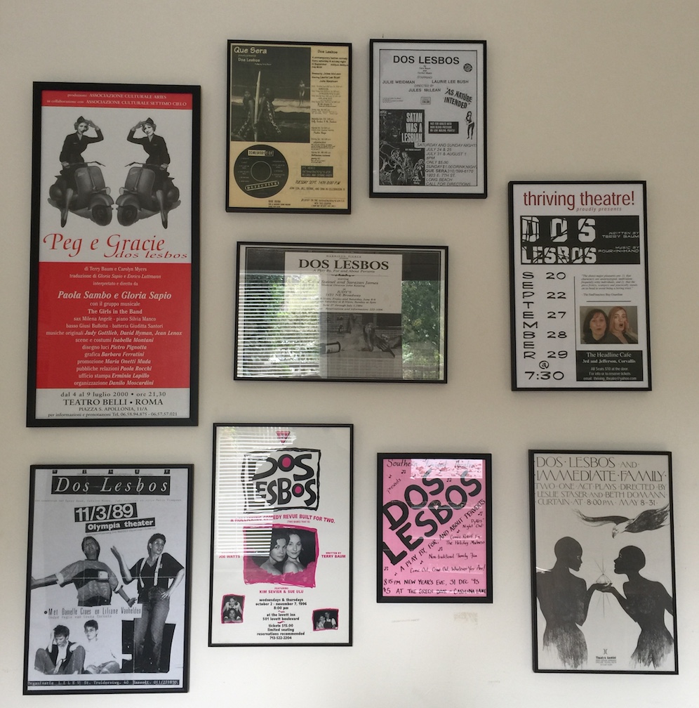 Wall of posters of Terry’s many independent productions of “Dos Lesbos,” including an Italian production (upper left), Belgium, 2016. Photo courtesy of Terry Baum.