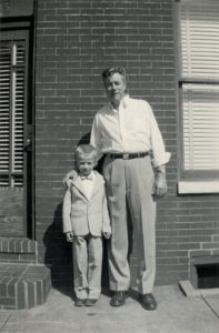 Tom Mosmiller posing with his father, Charles Augustus, Senior, in front of their home on Easter, 1954, Baltimore, MD.