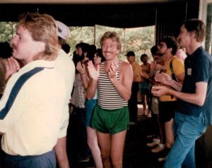 Tom Mosmiller dancing in green shorts having fun during the 9th National Men and Masculinity Conference, 