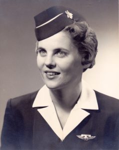 Trella Laughlin is an airline stewardess for AAL, 1958. Trella received the Distinguished Service Award for Valor for an emergency landing in mountains of Colorado.