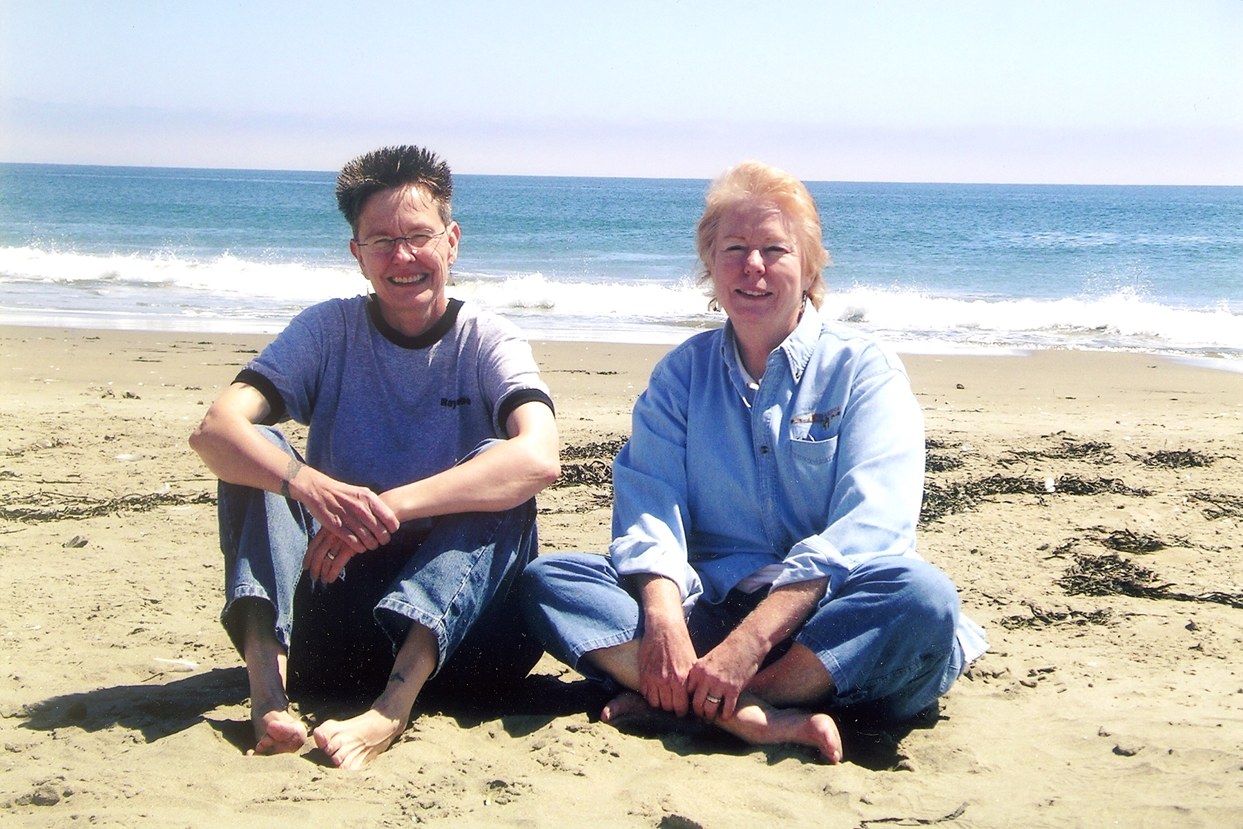 Vivienne Armstrong and Louise Young recreate an early photo of them together at Drakes Bay, Point Reyes National Seashore, August 2006, Marin County, CA. Photo Credit: Kate Trujillo Morello.