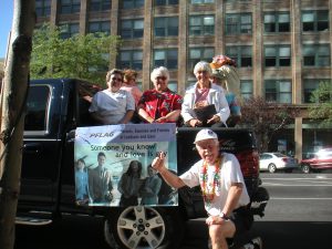 Millie and Gary at Gay Pride with facsimile of billboard that PFLAG put up during the 2002 Winter Olympics.