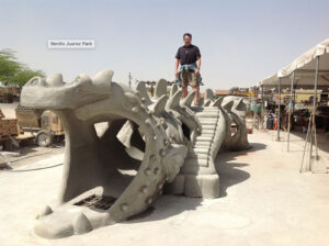 Jolino atop his dragon fabrication at Benito Juárez Park, Maywood, CA, 2013.