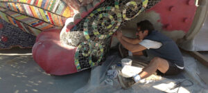 Jolino creating his mosaic dragon at Benito Juárez Park, Maywood, CA, 2013.