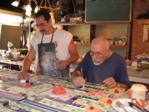 Jolino and David, working on a Children’s Room mosaic commission, in the artist’s studio of the Alhambra Public Library, Alhambra, CA, circa 2007.