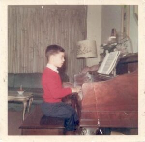 Kenny at the piano in Brooklyn, NY, circa 1960s.