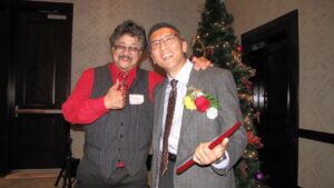 Terry Gock receiving the Dr. Susan Mandel Leadership Award in 2012. He’s pictured here with Dr. Glenn Masuda, one of the Nominators.