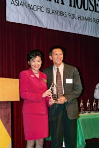 Terry Gock receiving the Asian Pacific Islanders for Human Rights “Ohana Person of the Year” Award from Congresswoman Judy Chu, Los Angeles, CA.
