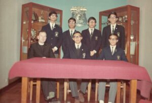 Terry Gock (seated at center) with Reverend Brother Alfonsus and the Executive Committee of the St. Joseph's College Social Service Group that Gock was involved in founding, Brooklyn, NY, 1978.