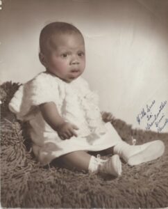 A baby portrait of Beverly at 6 months old, 1951. The inscription at right reads, “With Love, To: Grandmother, From Beverly”. Photo courtesy of Beverly Greene.