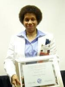 Beverly Greene holding her American Psychological Association (APA)’s Society for the Psychological Study of LGBTQ Issues’ Award for “Distinguished Scientific Contributions to LBGTQ Psychology”, 2008. Photo courtesy of Beverly Greene.