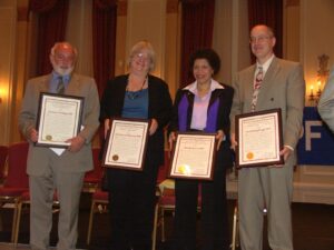 Beverly holding her American Psychological Association (APA) Award for “Distinguished Contributions to Psychology in the Public Interest” alongside her colleagues, 2009. Photo courtesy of Beverly Greene.