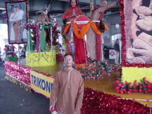 Arvind standing in front of the Trikone float during Pride, San Francisco, CA, 2003.