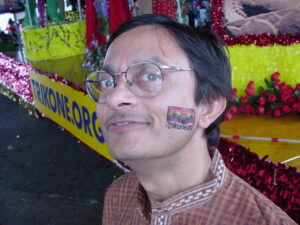 Arvind sporting a temporary rainbow tattoo that reads “Trikone.org” on his cheek during Pride, San Francisco, CA, 2003.