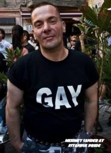 Mehmet wearing a black shirt that reads, “Gay”, at Istanbul Pride, Istanbul, Turkey. Photo courtesy of Mehmet Sander.	