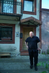 Mehmet standing in front of his home in Istanbul, Turkey. Photo courtesy of Mehmet Sander.