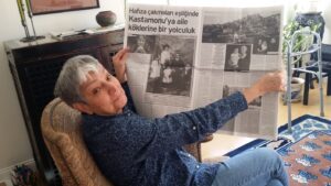 Arlene holding opening the pages of Aros, an Armenian newspaper printed in Istanbul. She shares, “They published an article I wrote about my visit to Kastomonu, the place where my grandparents lived and raised their family until my grandfather was taken into the army and never heard from again and then my grandmother and her children were forced out of their homes and into another town.” Photo courtesy of Arlene Avakian.