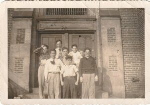Mel and his elementary school classmates at Eliza B. Kirkbride School, Philadelphia, PA. Mel is placed in the back row on the top step, “looking taller.”