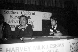 Cesar Chavez speaking at a meeting of the Southern California Harvey Milk Lesbian and Gay Democratic Club, photographed by Louis in 1982. The sign behind him reads, “Yes on A.B. 1.” Photo courtesy of Louis Jacinto.