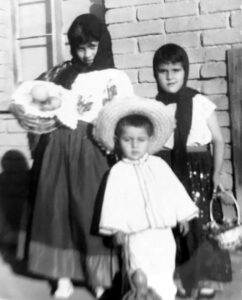 Louis (as a child) and two of his cousins dressed in traditional Mexican costumes to honor Our Lady of Guadalupe’s Feast Day, December 12, 1958. Photo courtesy of Louis Jacinto.