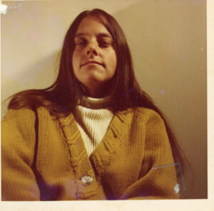 A portrait of Judy in a yellow sweater and turtleneck, 1970s. Photo courtesy of Santa Monica Public Library Image Archives, Judy Abdo Photo Album Collection.