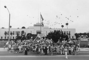 Attendees gathering and releasing balloons in front of Santa Monica City Hall for the annual Walk for the Homeless. Photo courtesy of Santa Monica Public Library Image Archives, Judy Abdo Photo Album Collection.
