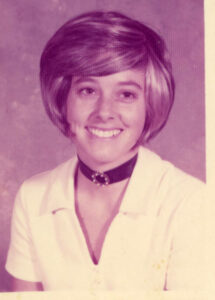 A portrait of Judy smiling in a black choker, either in Derby, KS or Prince George County, MD, 1970s. At the time, Judy was a kindergarten teacher in Capitol Heights, Maryland and later in Derby, Kansas. Joseph Abdo, her husband, was in training at Andrews Air Force Base near Capitol Heights. Photo courtesy of Santa Monica Public Library Image Archives, Judy Abdo Photo Album Collection.