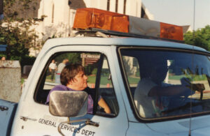 Judy Abdo riding in a Recreation and Parks, General Services Department truck, 1990s. Photo courtesy of Santa Monica Public Library Image Archives, Judy Abdo Photo Album Collection.