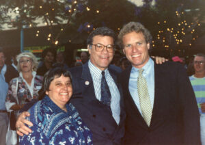 L-R: Judy Abdo, an unidentified man, and Joe Kennedy smiling during Kennedy's visit to Santa Monica's Third Street Promenade, 1990s. From 1987 to 1999, Joseph P. Kennedy II served in the U.S. House of Representatives representing the 8th congressional district of Massachusetts. Photo courtesy of Santa Monica Public Library Image Archives, Judy Abdo Photo Album Collection.