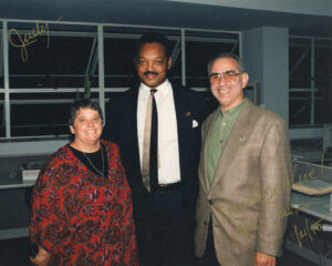 A signed portrait of Judy Abdo, Jesse Jackson and Paul Rosenstein at Santa Monica College, December 21, 1995. It reads, “Judy–” in gold ink at the top left corner. Photo courtesy of Santa Monica Public Library Image Archives, Judy Abdo Photo Album Collection.
