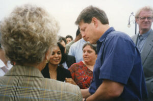 Vice President Al Gore meeting with city officials during a visit to Santa Monica, September 17, 1999. Judy Abdo (in a patterned red blouse) stands next to Gore. Gore served two terms as Vice President in the Clinton Administration from 1993 to 2001. Photo courtesy of Santa Monica Public Library Image Archives, Judy Abdo Photo Album Collection.