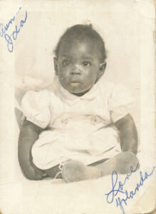 A baby portrait of Yoseñio signed “Aunt Ida, Love Yolanda.” Photo courtesy of Yoseñio Lewis.