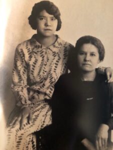 A portrait of Terri’s mother Juanita Escobedo with Terri’s maternal grandmother Higinia Alarcon Escobedo. Terri shares, “They immigrated to the U.S. from Chihuahua, Mexico in 1919. This photo is circa late 1920s or early 1930s, before my parents’ marriage in 1934. My grandmother Higinia was a very strong-willed woman and has been a major influence in my life.” Photo courtesy of Terri de la Peña. 