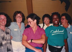 The fiction group at the Flight of the Mind Women Writers’ Workshop in McKenzie River, OR, 1988. Front row, L-R: Valerie Miner (the instructor) Treth (Linda Trethaway), Molly Martin, and April Sinclair. Back row, L-R: Terri de la Peña, Mary McNeil. Photo courtesy of Terri de la Peña.