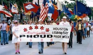 Deborah marching as one of the Co-Chairs of Houston Pride, Houston, TX, 1988. Their sign reads, “Rightfully Proud – Houston Lesbian/Gay Pride Week, 1988.” Photo courtesy of Deborah Moncrief Bell.