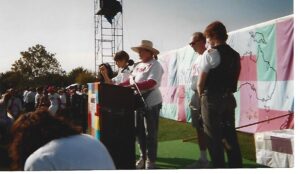 Deborah reading the names of those who died from HIV/AIDS as part of the NAMES Project AIDS Memorial Quilt, which was displayed in Houston, TX, 1992. Photo courtesy of Deborah Moncrief Bell.