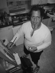 A portrait of Miguel painting acrylic on canvas in his kitchen, Palm, Springs, 2012. Photo courtesy of Miguel Criado