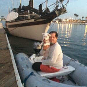 Miguel and his dog Chico at the Neverland, docked at Alamitos Way, Long Beach, CA, 2013. Photo courtesy of Miguel Criado.