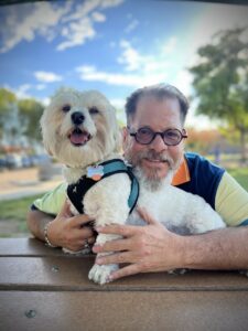 Miguel hugging Baxter at the Palm Springs Dog Park, Palm Springs, CA, 2022. Photo courtesy of Miguel Criado.